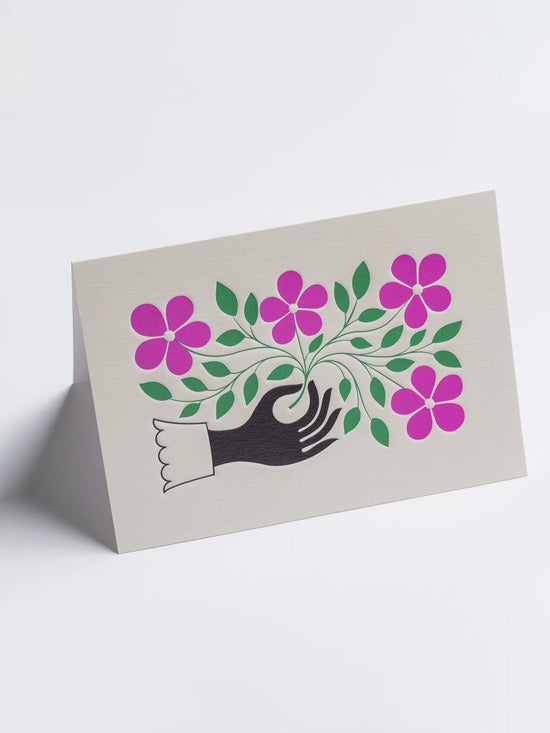 Hand and Flower Greeting Card