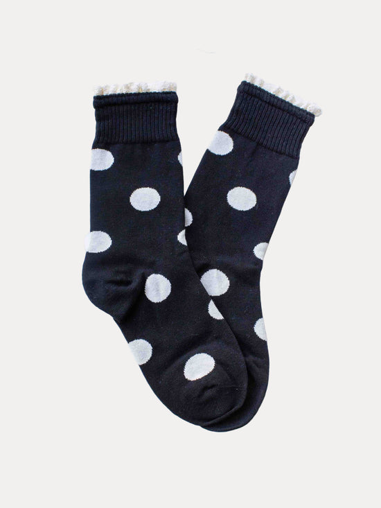 Black socks with white polka dots on a white background